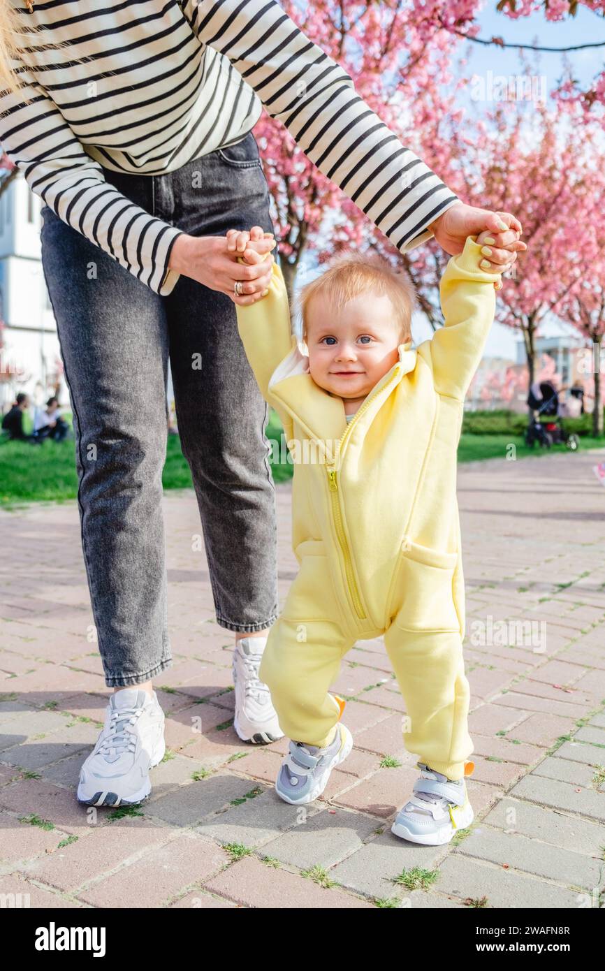 Baby learns to walk hi-res stock photography and images - Alamy