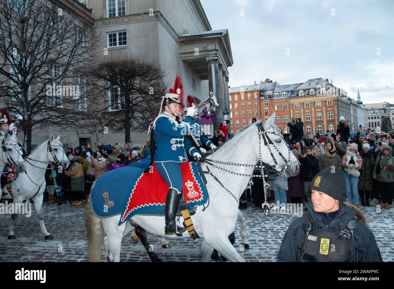 The Queen rides in the Gold Coach, escorted by the Guard Hussar
