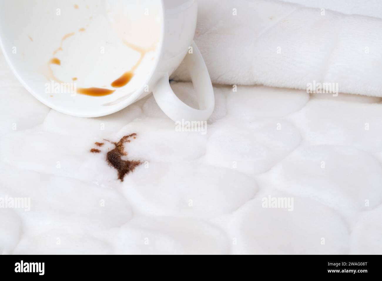 Spilled coffee on the upholstery of the couch or carpet. dirty stains in daily life for cleaning concept. Stock Photo