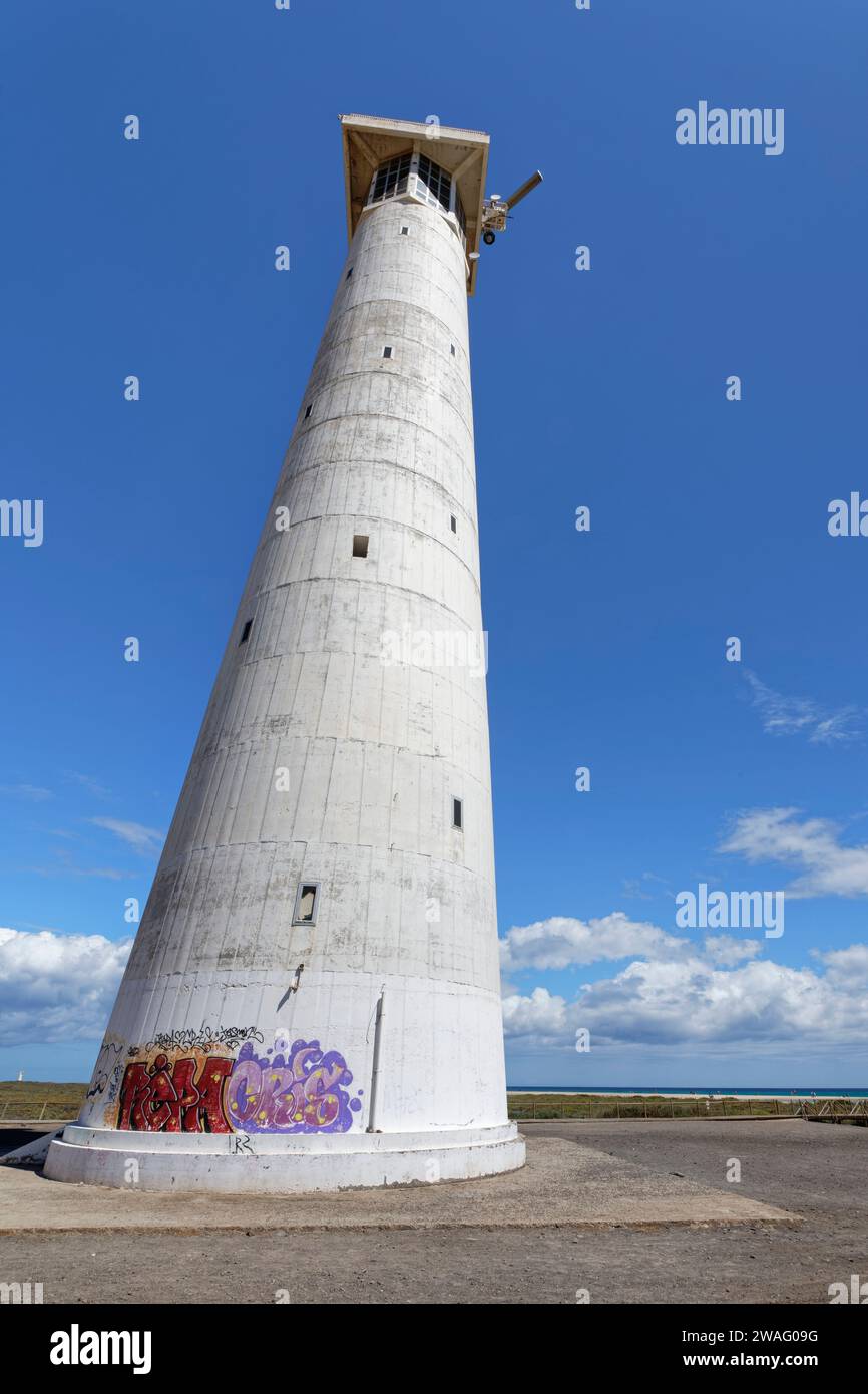 Morro Jable lighthouse with spray painted graffiti at the base, Jandia, Fuerteventura, September. Stock Photo