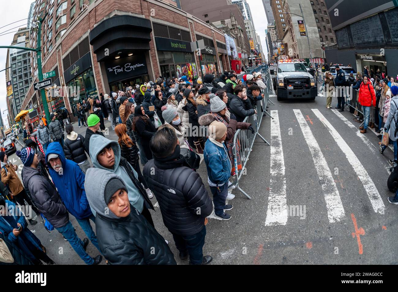 Thousands of visitors at the police barricades waiting to enter Times Square in New York on Sunday, December 31, 2023. After the police allow entry the revelers have an hours long wait until the New Year. (© Richard B. Levine) Stock Photo
