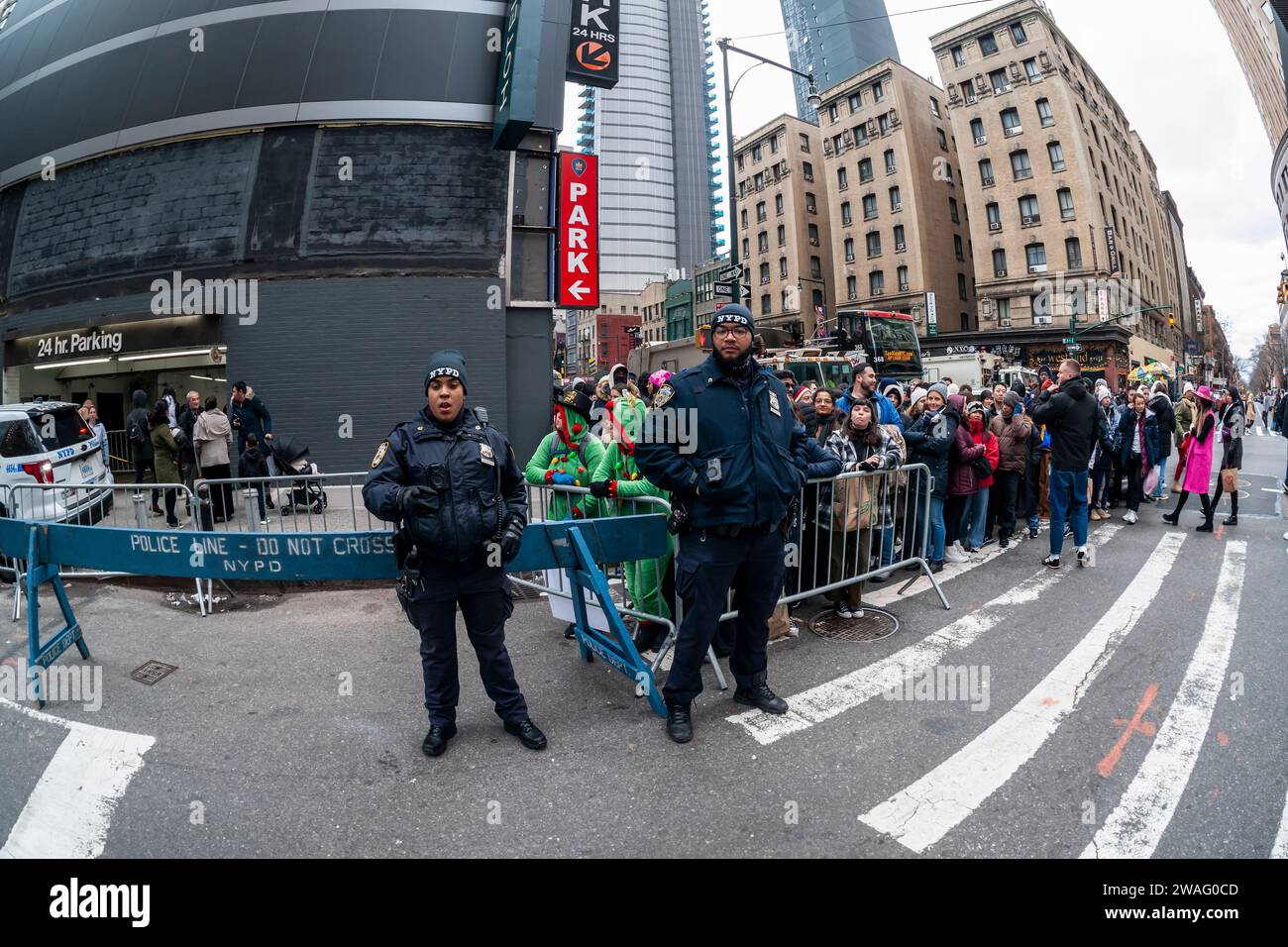 Thousands of visitors at the police barricades waiting to enter Times Square in New York on Sunday, December 31, 2023. After the police allow entry the revelers have an hours long wait until the New Year. (© Richard B. Levine) Stock Photo