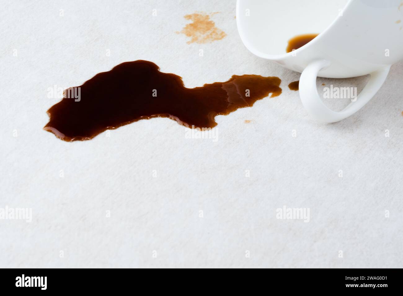 Spilled coffee on the upholstery of the couch or carpet. dirty stains in daily life for cleaning concept. Stock Photo
