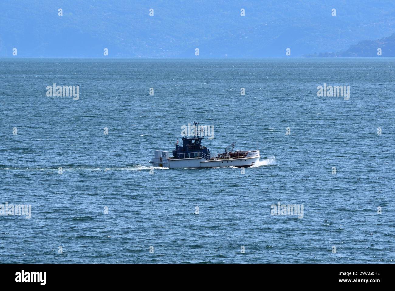 Fior D'Arancio III, a small commercial vessel, is seen on Lake Maggiore, Italy. Stock Photo