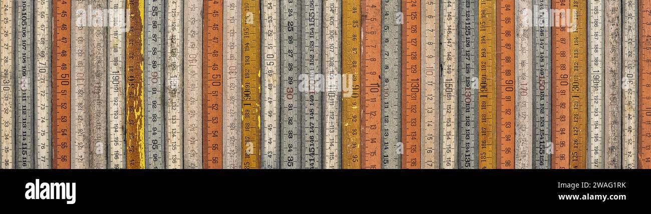 A variety of vintage wooden folding rulers Stock Photo