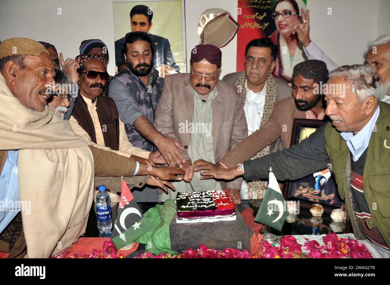 Leaders and activists of Peoples Party (PPP) are cutting cake as they are marking 96th Birthday Anniversary of Zulfiqar Ali Bhutto, during celebration ceremony held in Hyderabad on Thursday, January 4, 2024. Stock Photo