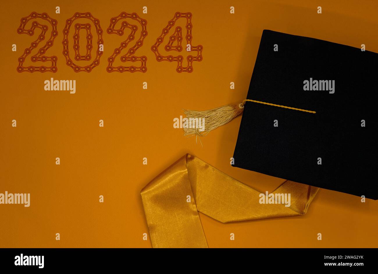 Graduation cap on orange background with 2024 Happy New Year made from ...