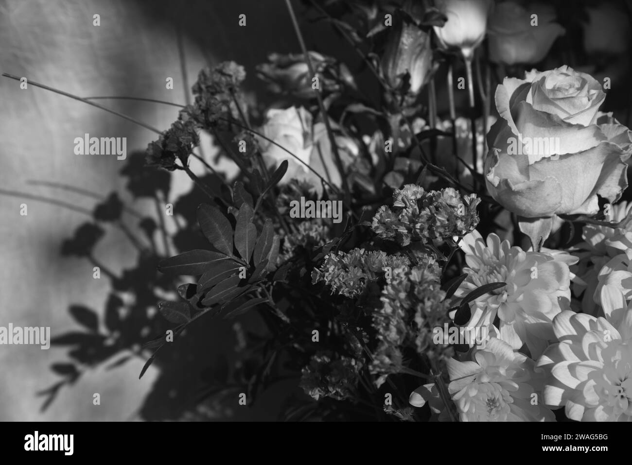 Bouquet with roses. Mourning funeral flowers. Black white floral
