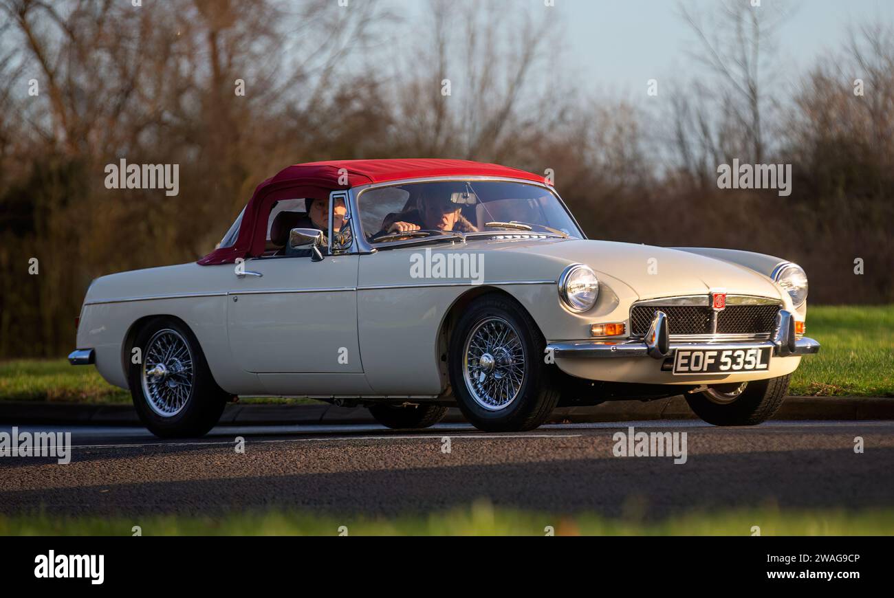 Stony Stratford,UK Jan 1st 2024. 1972 white MG B sports car arriving at