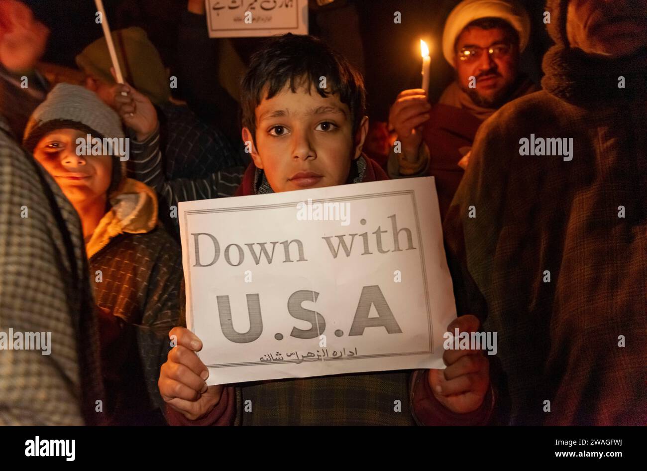 Srinagar, India, 04/01/2024, A Kashmiri Shia Muslim kid holds a placard ...
