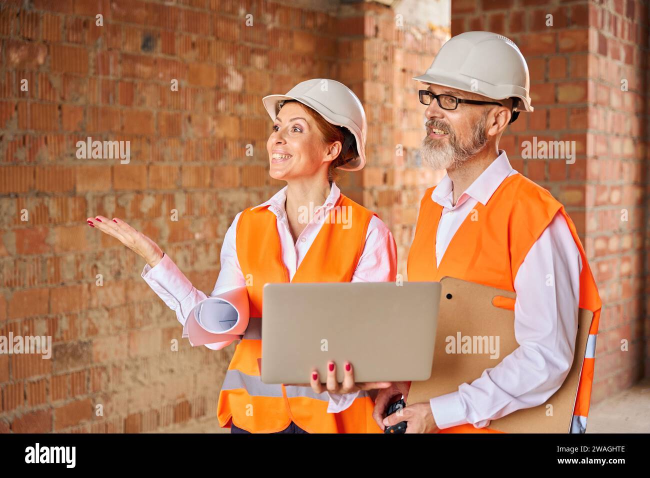 Construction supervisor showing something to foreman about the building Stock Photo