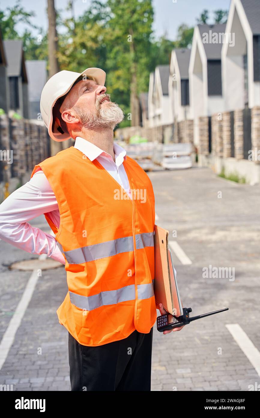 Building site inspector conducting inspection of housing complex Stock Photo Alamy