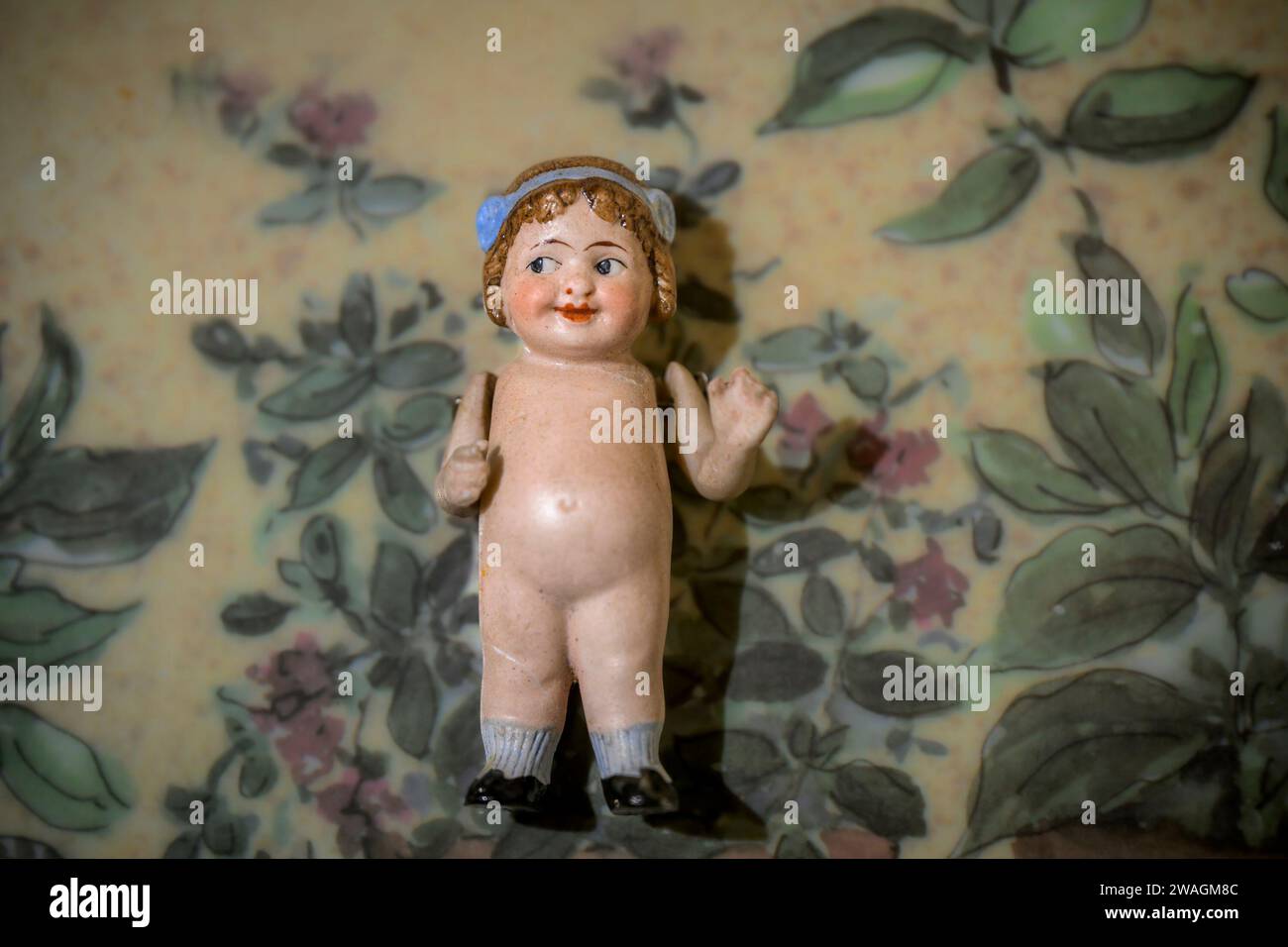 Vintage, bisque, flapper, miniature, kewpie doll, with articulated arms Stock Photo