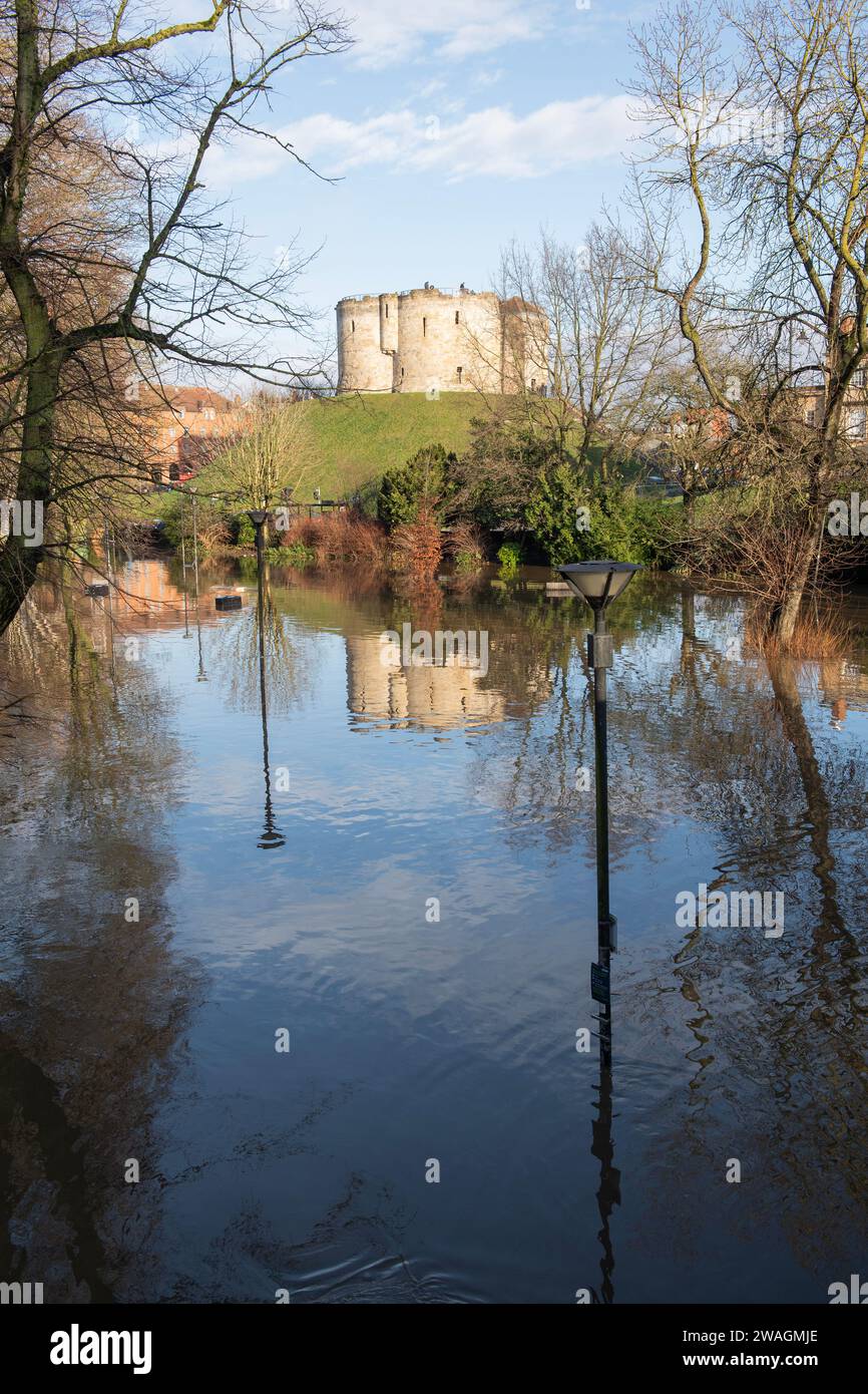 Flooding in York city centre on 4th January 2024 with Cliffords Tower reflected in the flood waters of Tower Gardens Stock Photo