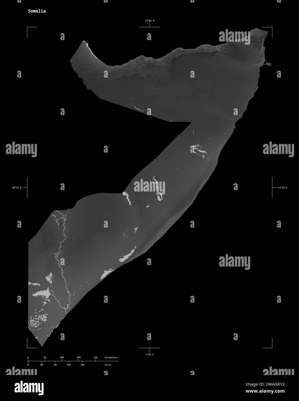 Shape of a Grayscale elevation map with lakes and rivers of the Somalia, with distance scale and map border coordinates, isolated on black Stock Photo