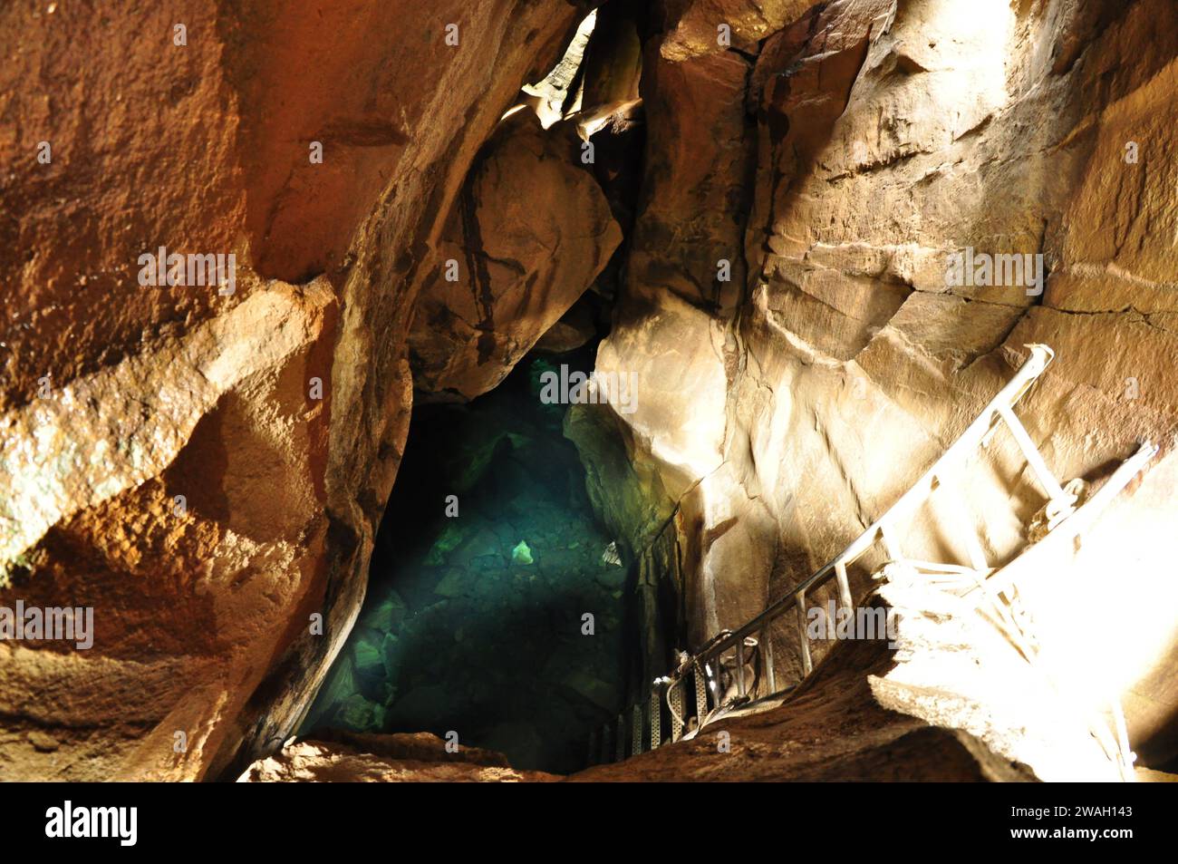Blue-green hot spring water in Grjotagja cave in Iceland Stock Photo