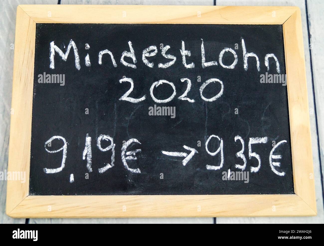 writing board with increase in the minimum wage from 9.19 euros to 9.35 euros, 2020, symbolic image Stock Photo