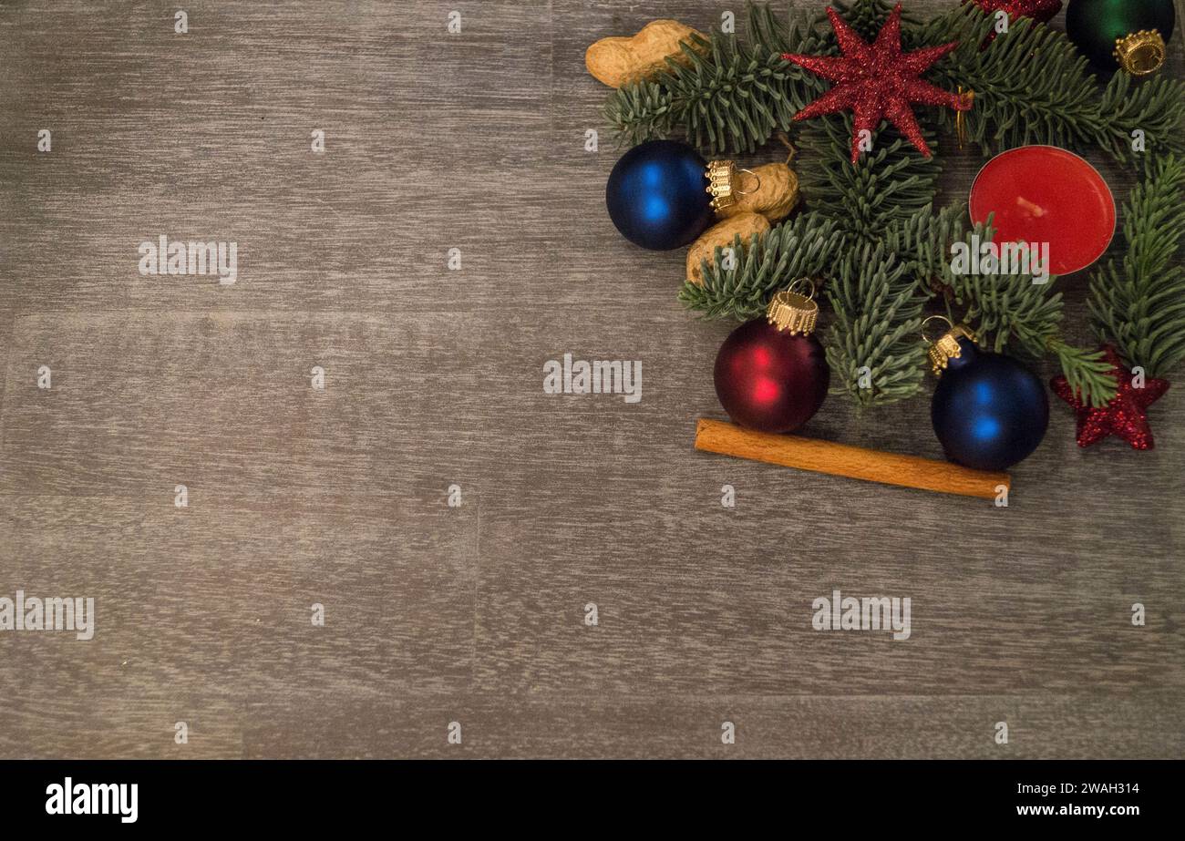 fir branches, Christmas baubles, spices and peanuts as Christmas decorations Stock Photo