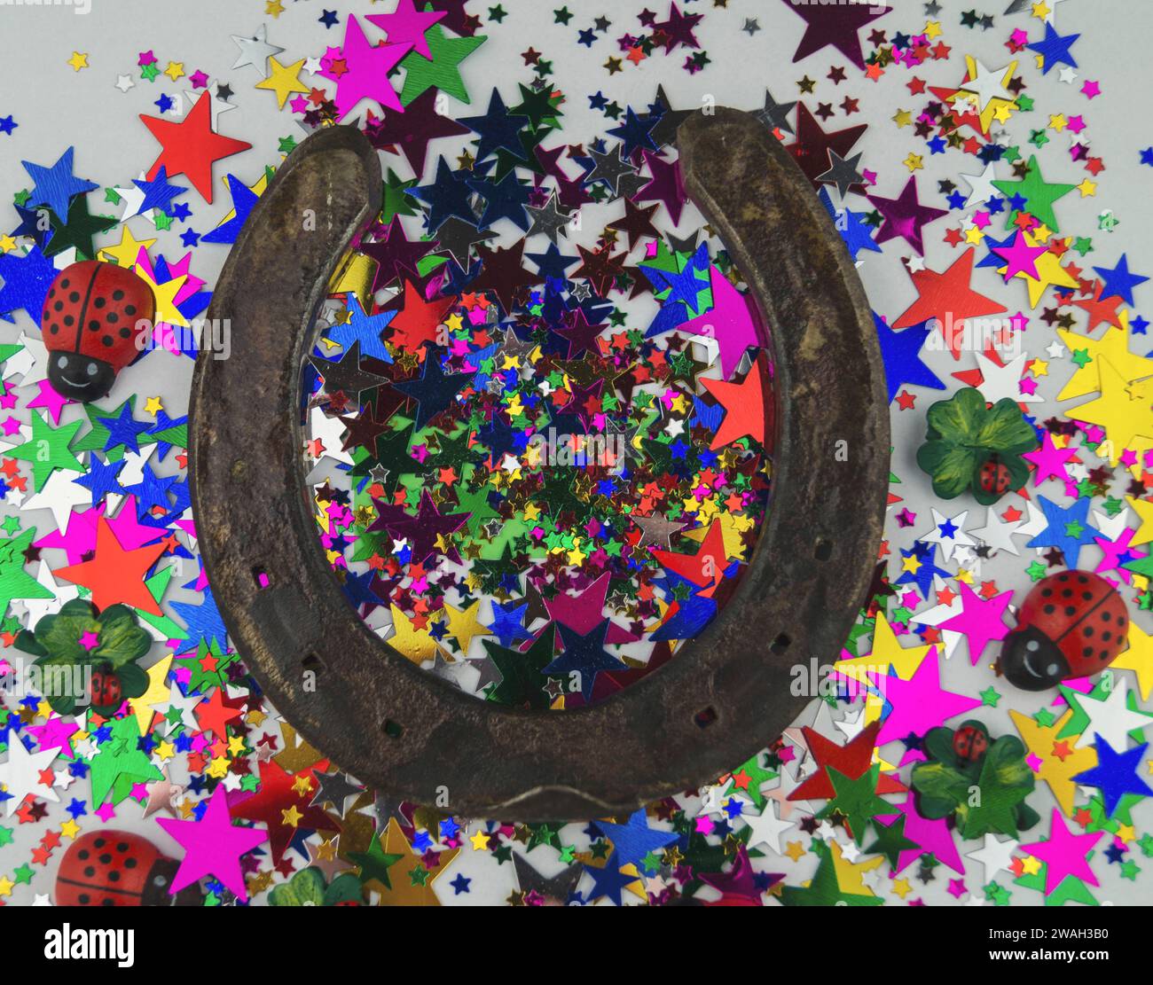 horseshoe and star glitter, lucky charms for New Year's Eve, symbolic image Stock Photo