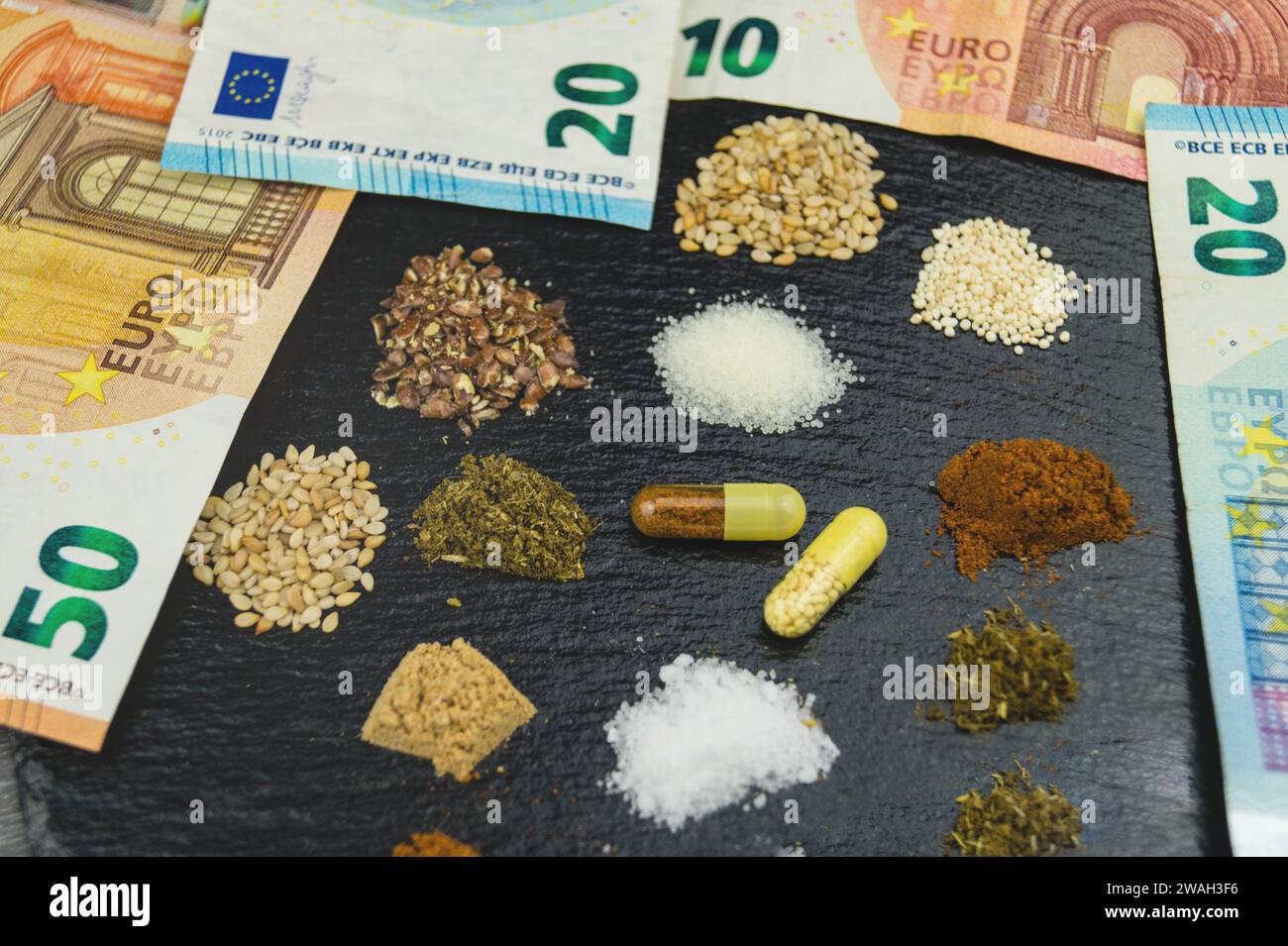 Nutritional supplements in pills with Euro bills Stock Photo