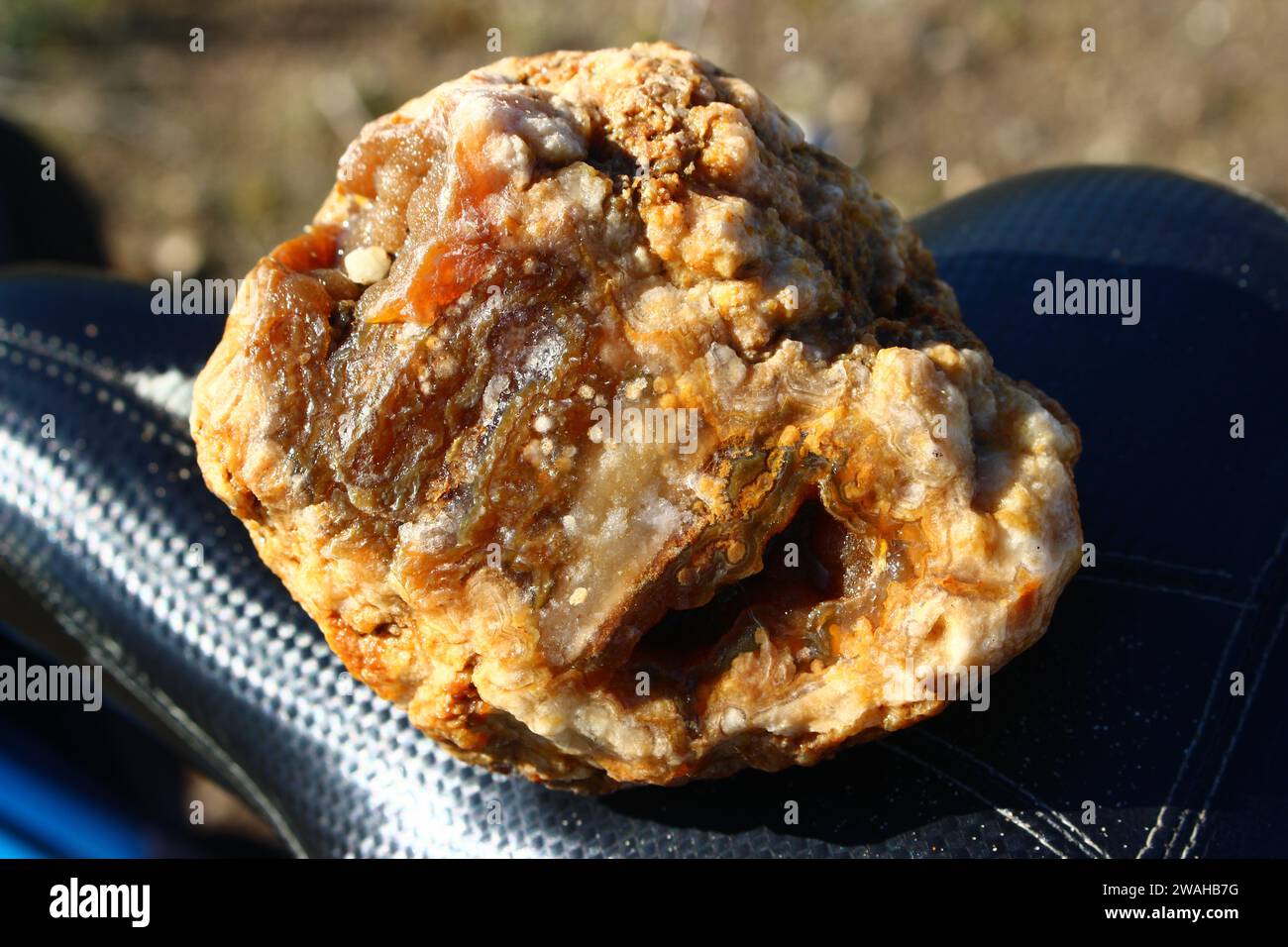 Raw unprocessed agate with a small geode found in nature. Kaluga region, Russia Stock Photo