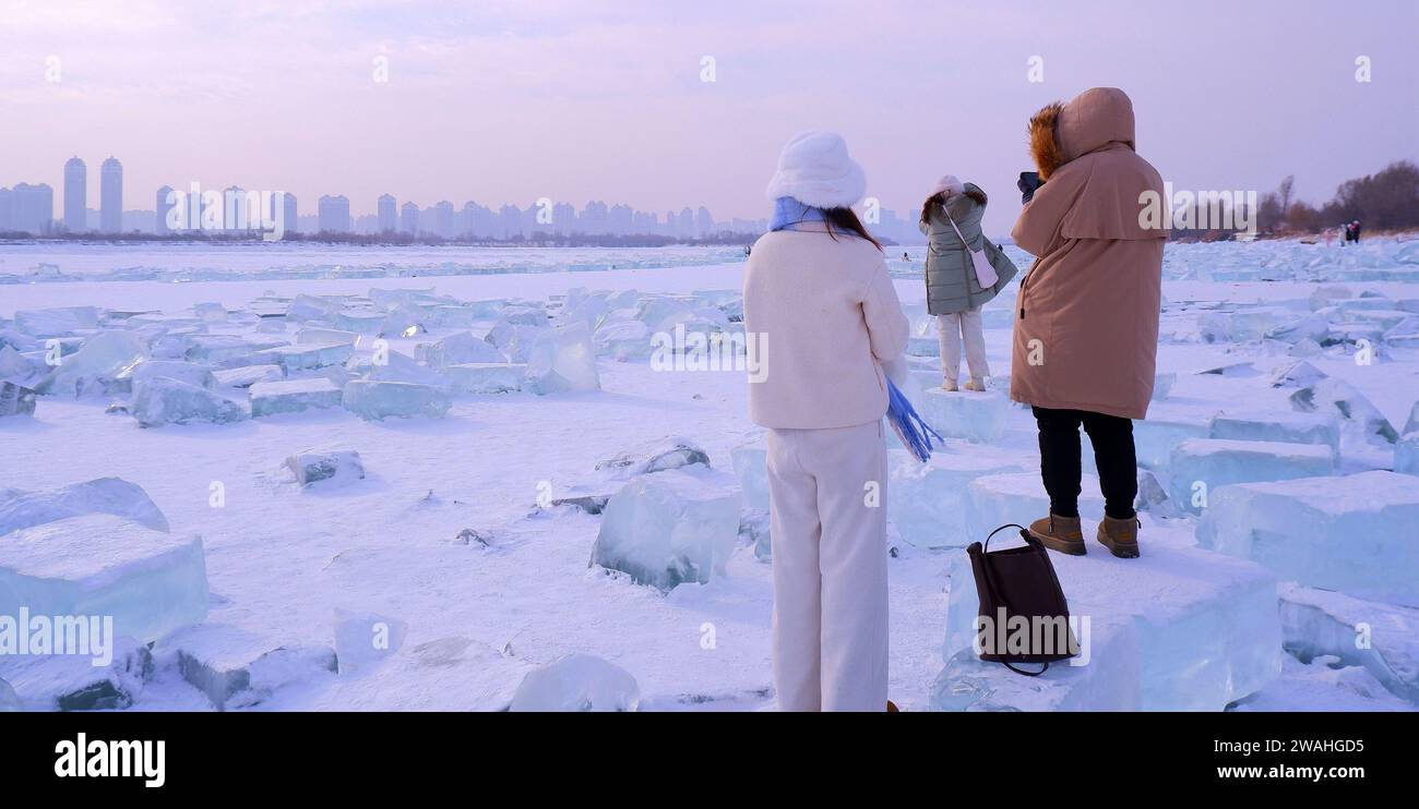 Ice blocks on the frozen Songhua River look like diamonds in Harbin