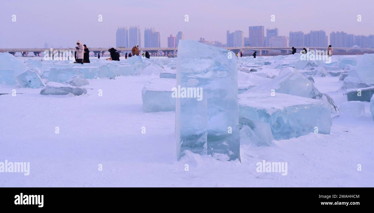 Ice blocks on the frozen Songhua River look like diamonds in Harbin