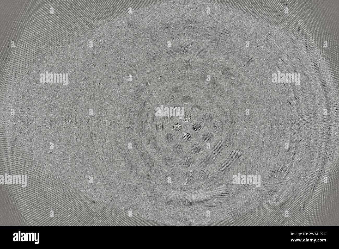 Grey illustration resembling sink drain with small holes in center and
