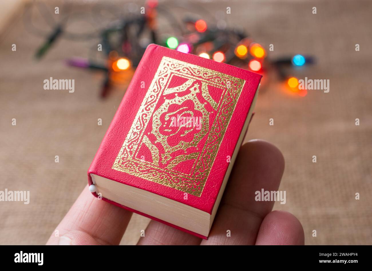 Islamic Holy Book Quran with lights behind Stock Photo