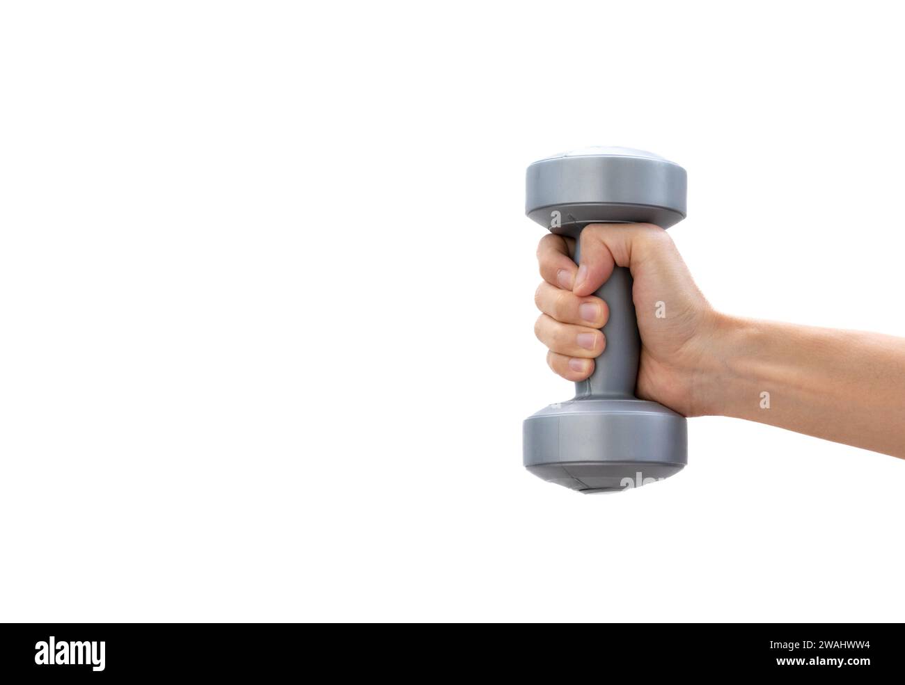 Concept for healthy lifestyle and imrpovement. Skinny young man holding a plastic dumbbell. After some edits. Stock Photo