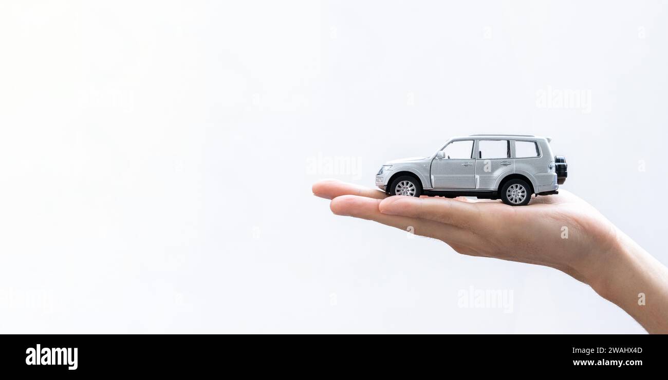 Kids hand holding toy car hi-res stock photography and Kids hand holding toy car hi-res stock photography and