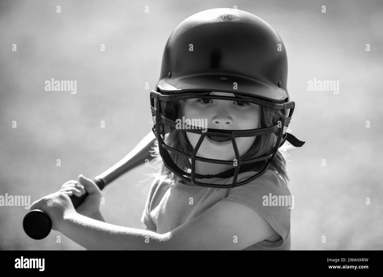 Kid baseball ready to bat. Child batter about to hit a pitch during a