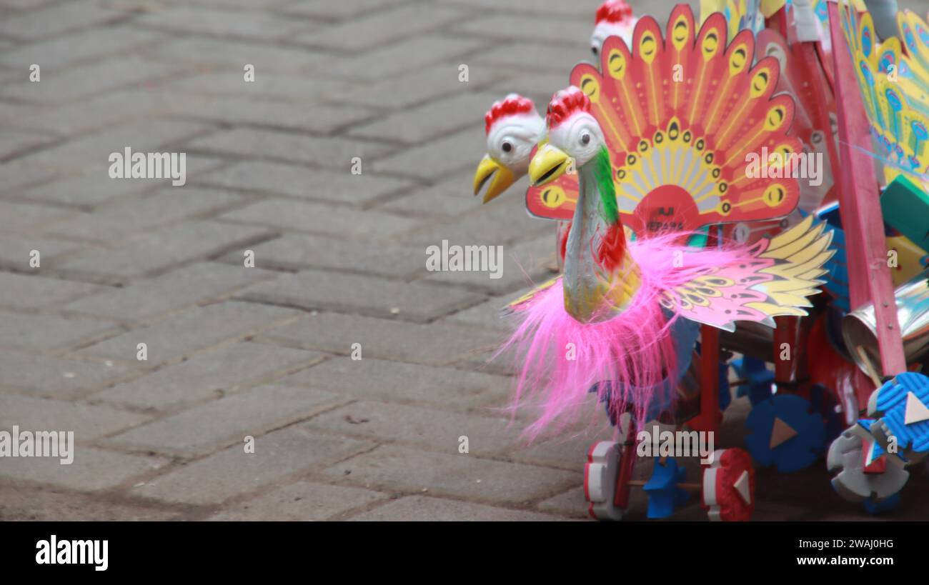 Indonesian children's traditional toy, shaped like an animal with wheels, the toy will make a sound when it is run. Stock Photo