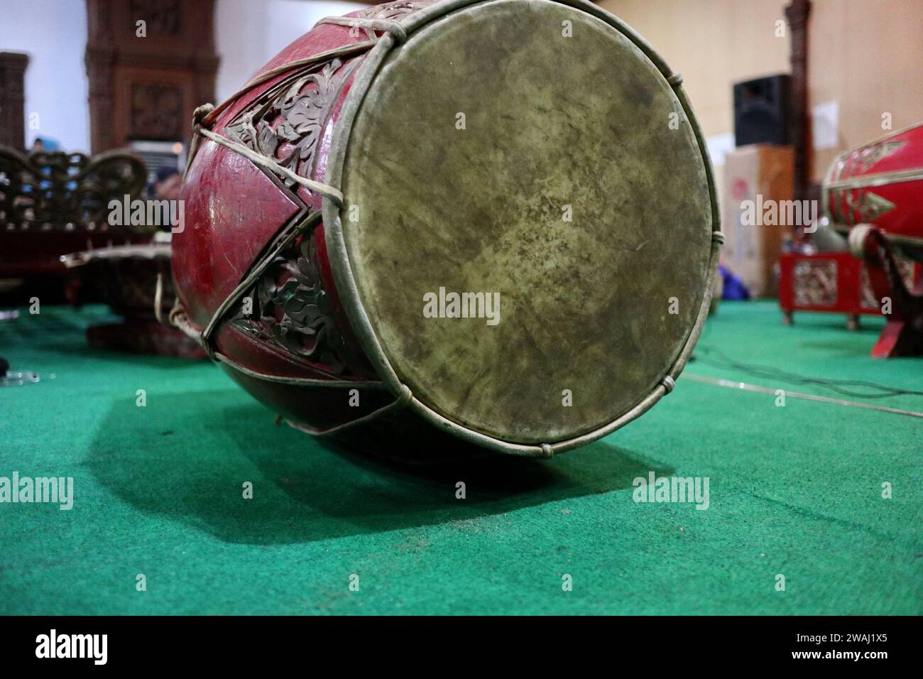 Traditional music instrument called gendang or kedang in selective focus and lowlight Stock Photo