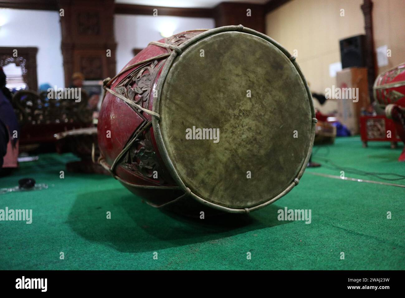 Traditional music instrument called gendang or kedang in selective focus and lowlight Stock Photo