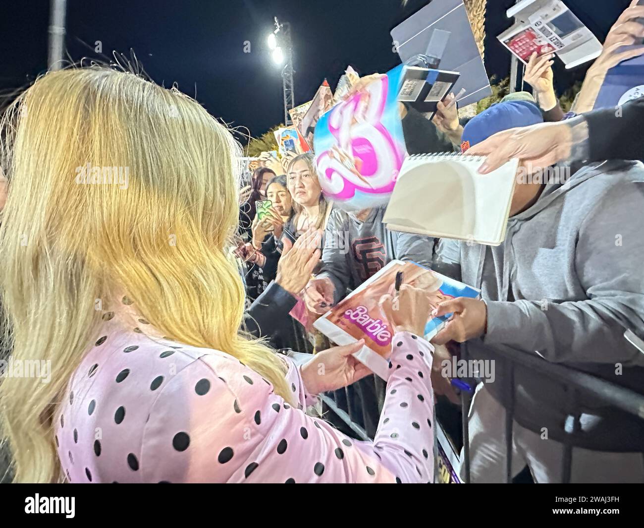 Palm Springs, California, U.S.A. 4th Jan, 2024. Margot Robbie signs