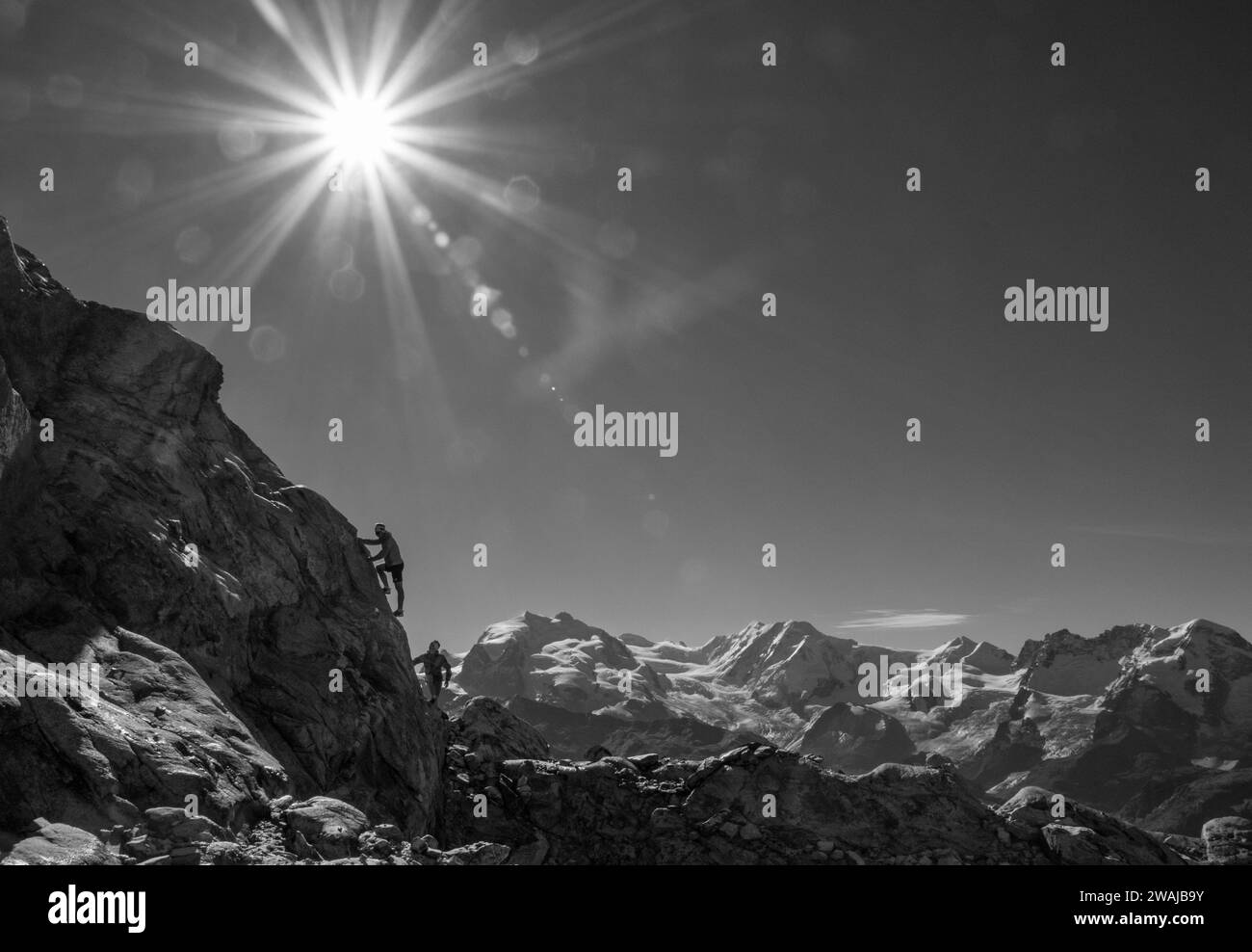 Mountaineer climbing mountain side view Black and White Stock Photos ...