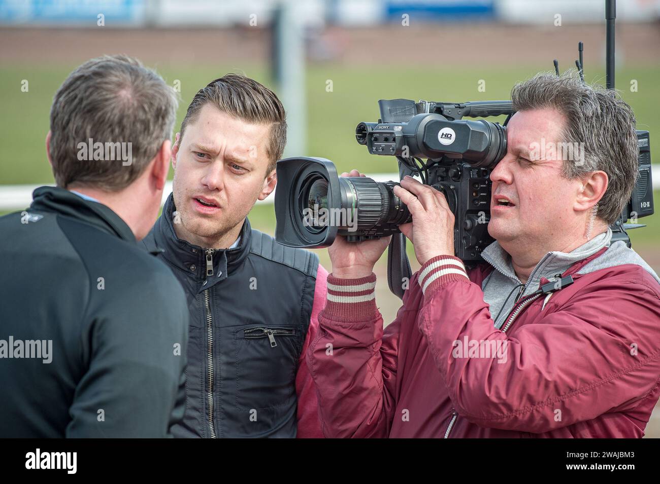 Per Skoglund a Swedish TV-personality for TV4 leading a broadcast from Mantorp race course during the Olympic Trotting competition Stock Photo