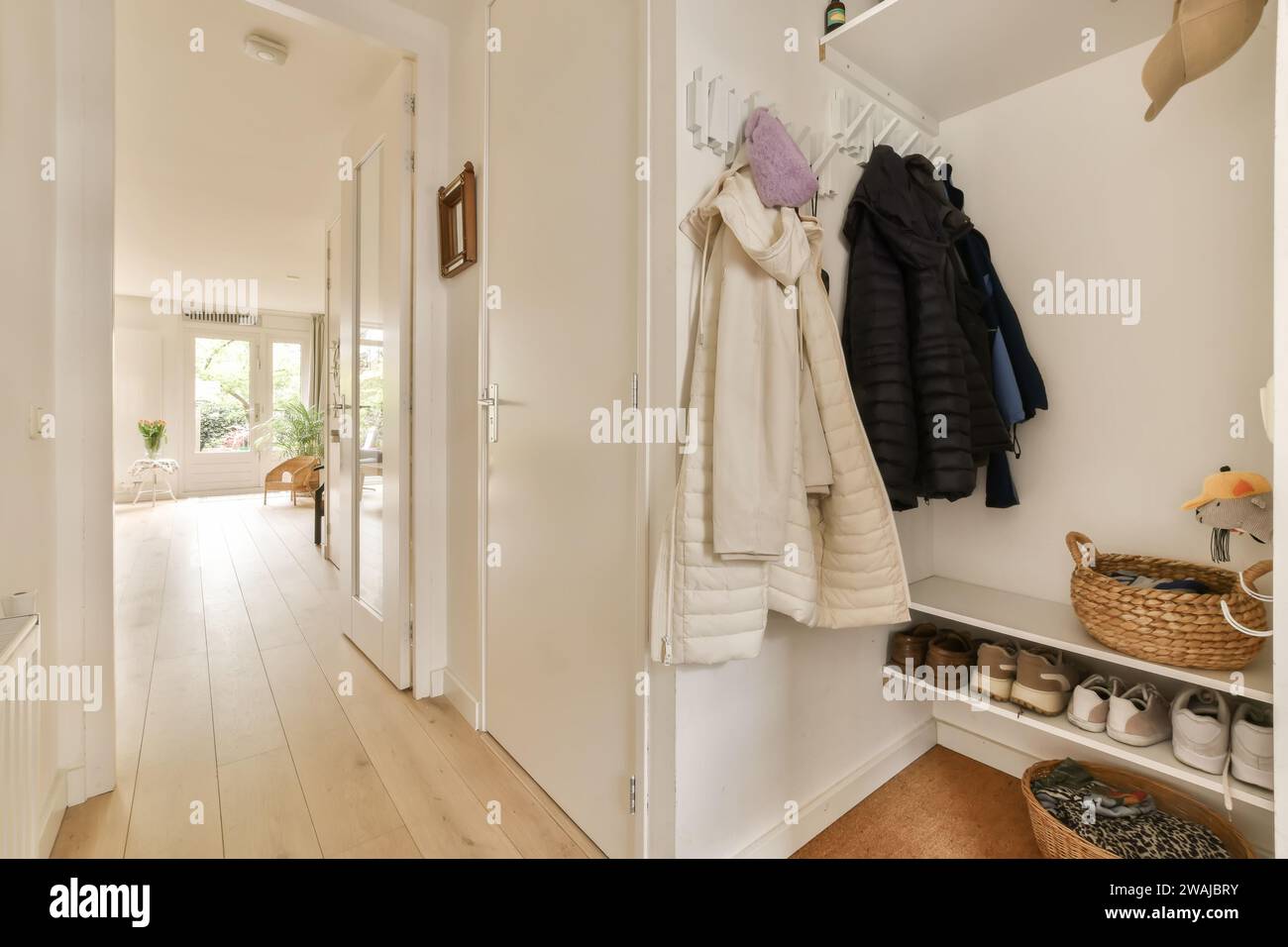 Coats hanging wall hi-res stock photography and images - Alamy