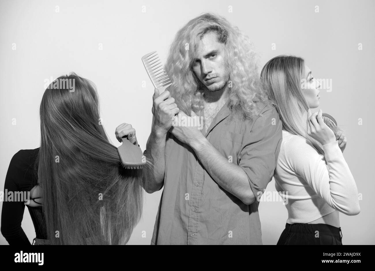 Group of young women and man combing hair. People combing hair, girls