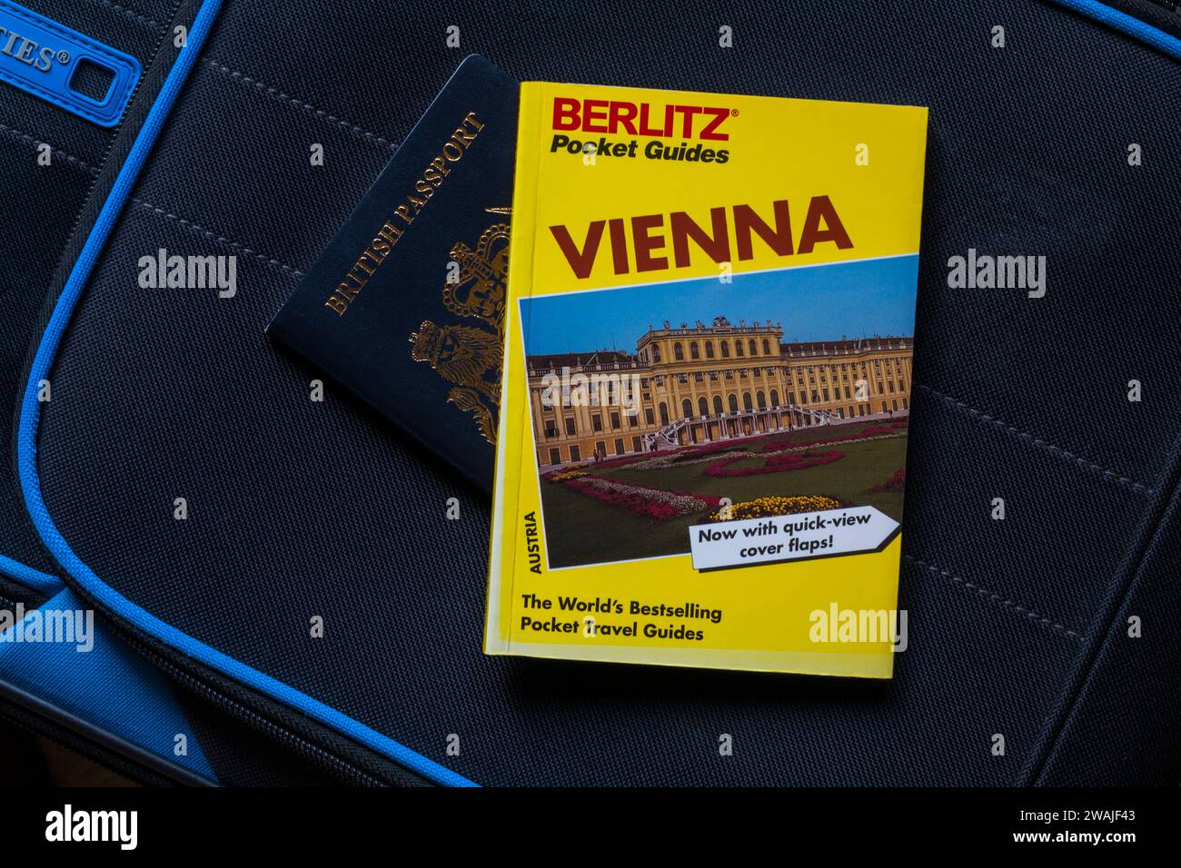 Vienna Berlitz Travel Guide book with British passport on suitcase - holiday vacation travel concept - Berlitz pocket guides Stock Photo