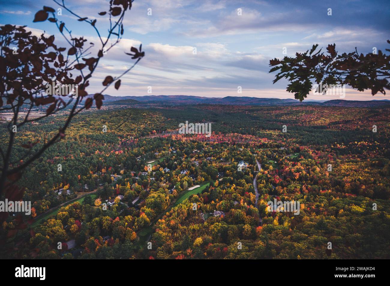 The fall colors glow below Whitehorse Ledge in North Conway, NH Stock