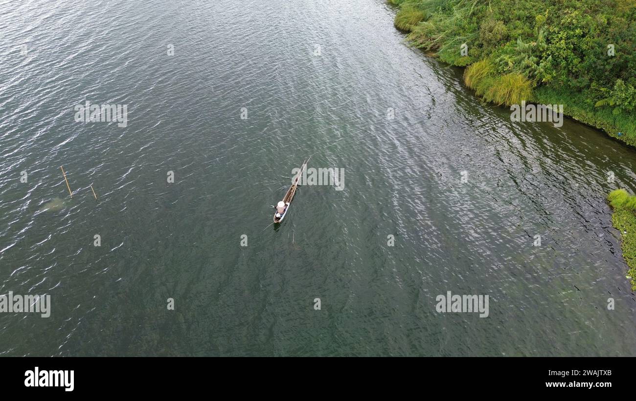 Capture the serene beauty of a stunning aerial view of a pristine lake ...