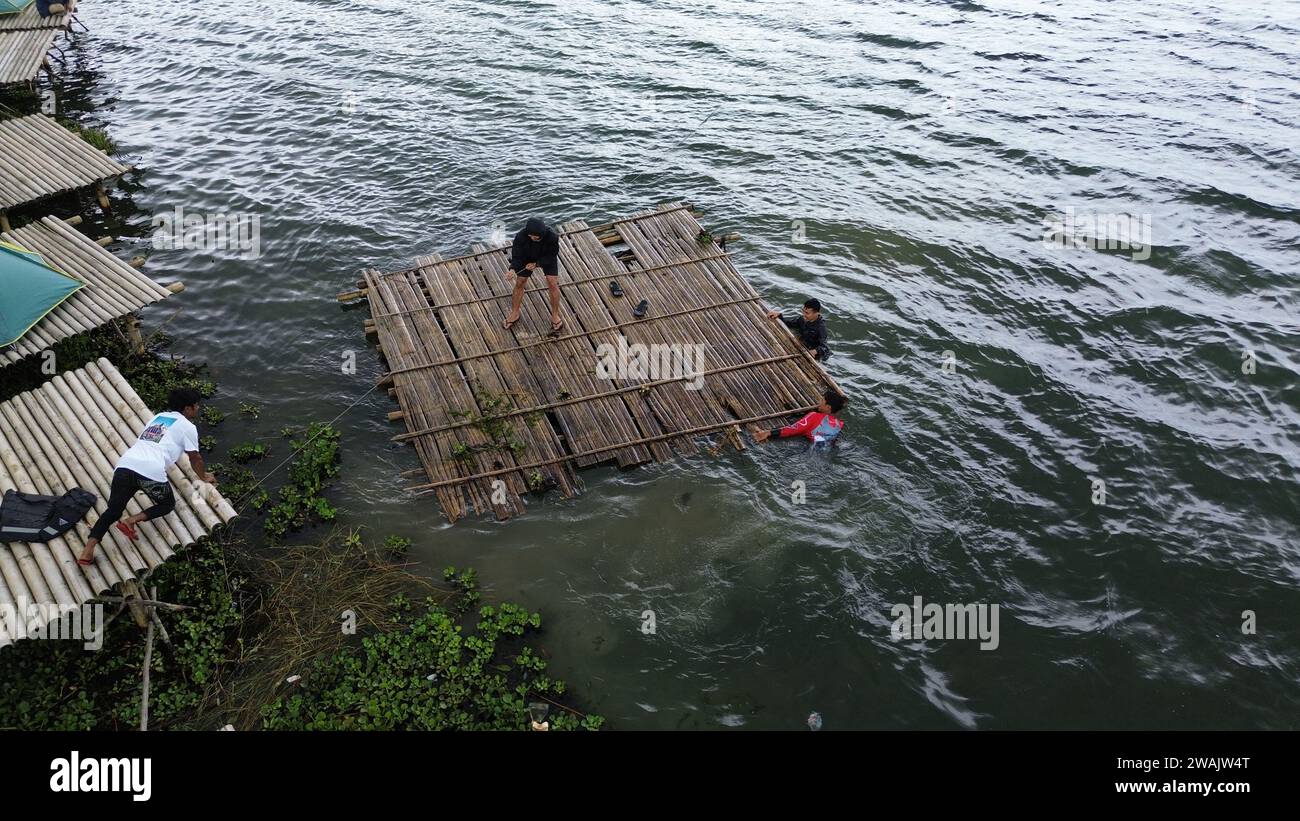 Capture the serene beauty of a stunning aerial view of a pristine lake ...