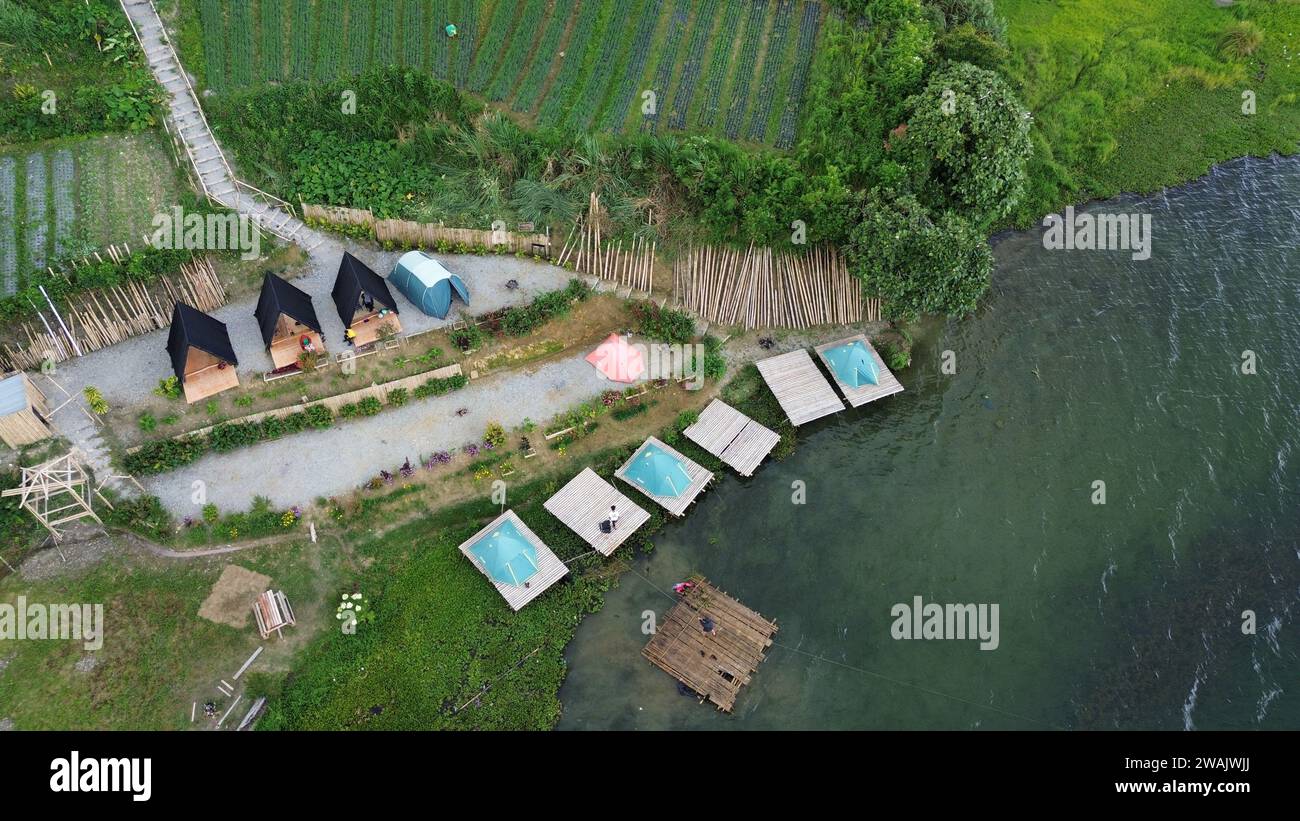Capture the serene beauty of a stunning aerial view of a pristine lake ...