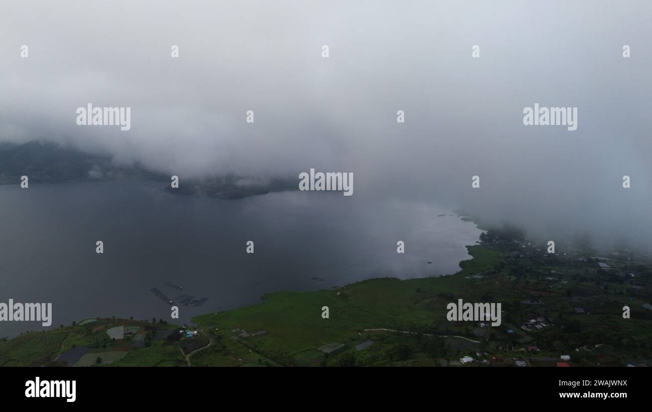 Capture the serene beauty of a stunning aerial view of a pristine lake ...