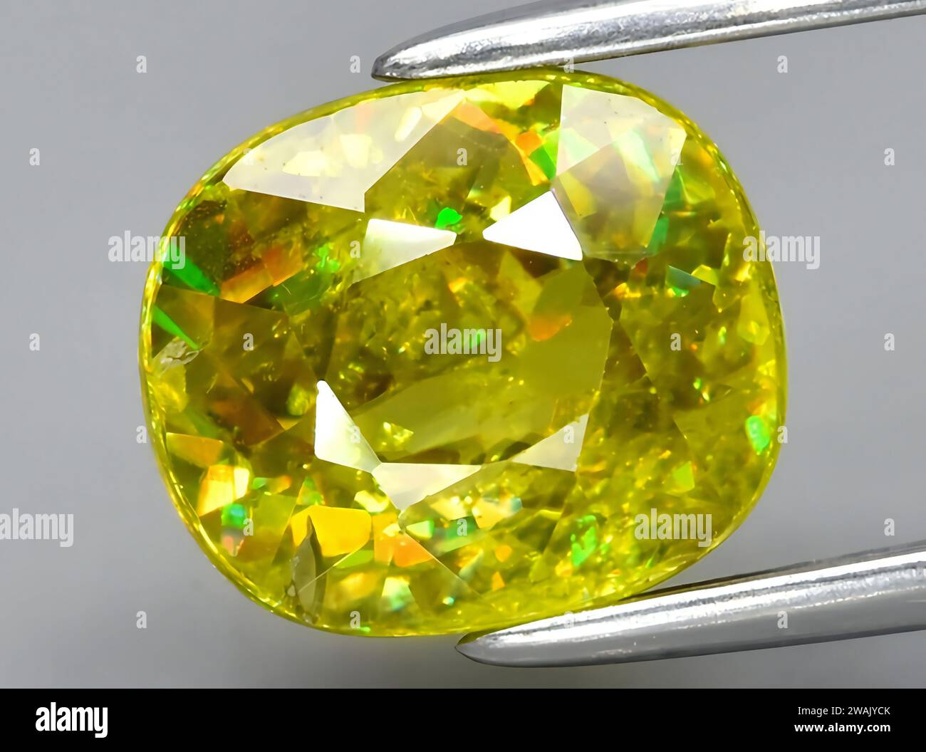 natural green sphene titanite gem on background Stock Photo