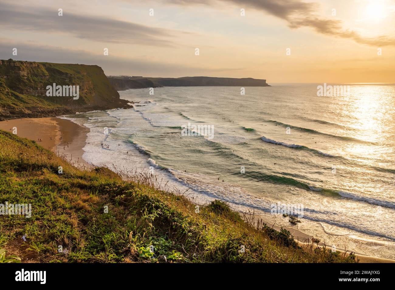 Top view of the sunset over Los Locos beach and the Atlantic Ocean with high waves. Suances, Cantabria, Spain. Stock Photo