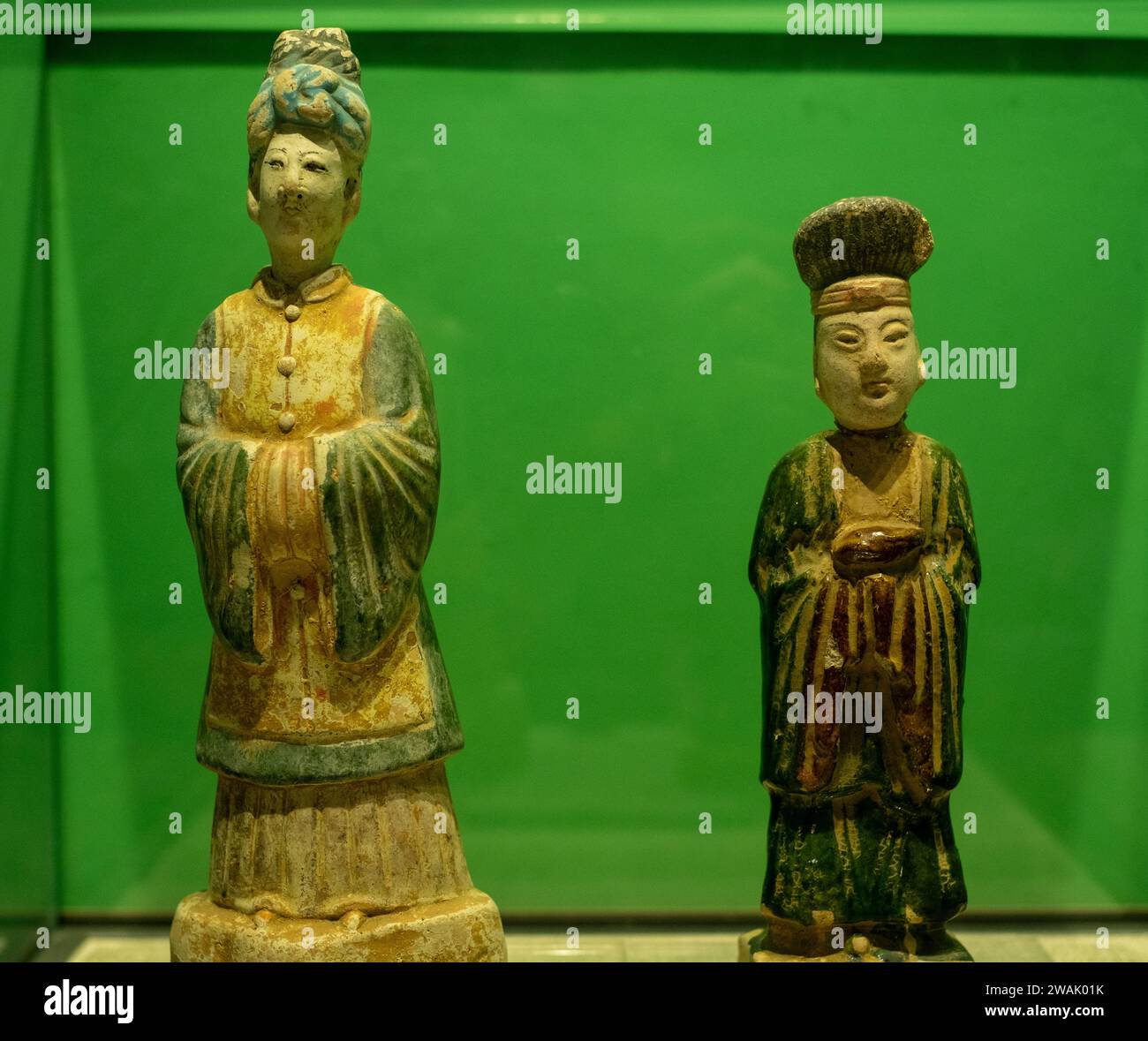 Tri-coloured Glazed Pottery of Khitan woman and man in Liao Dynasty (907–1125). Tongzhou Museum in Beijing, China. Stock Photo