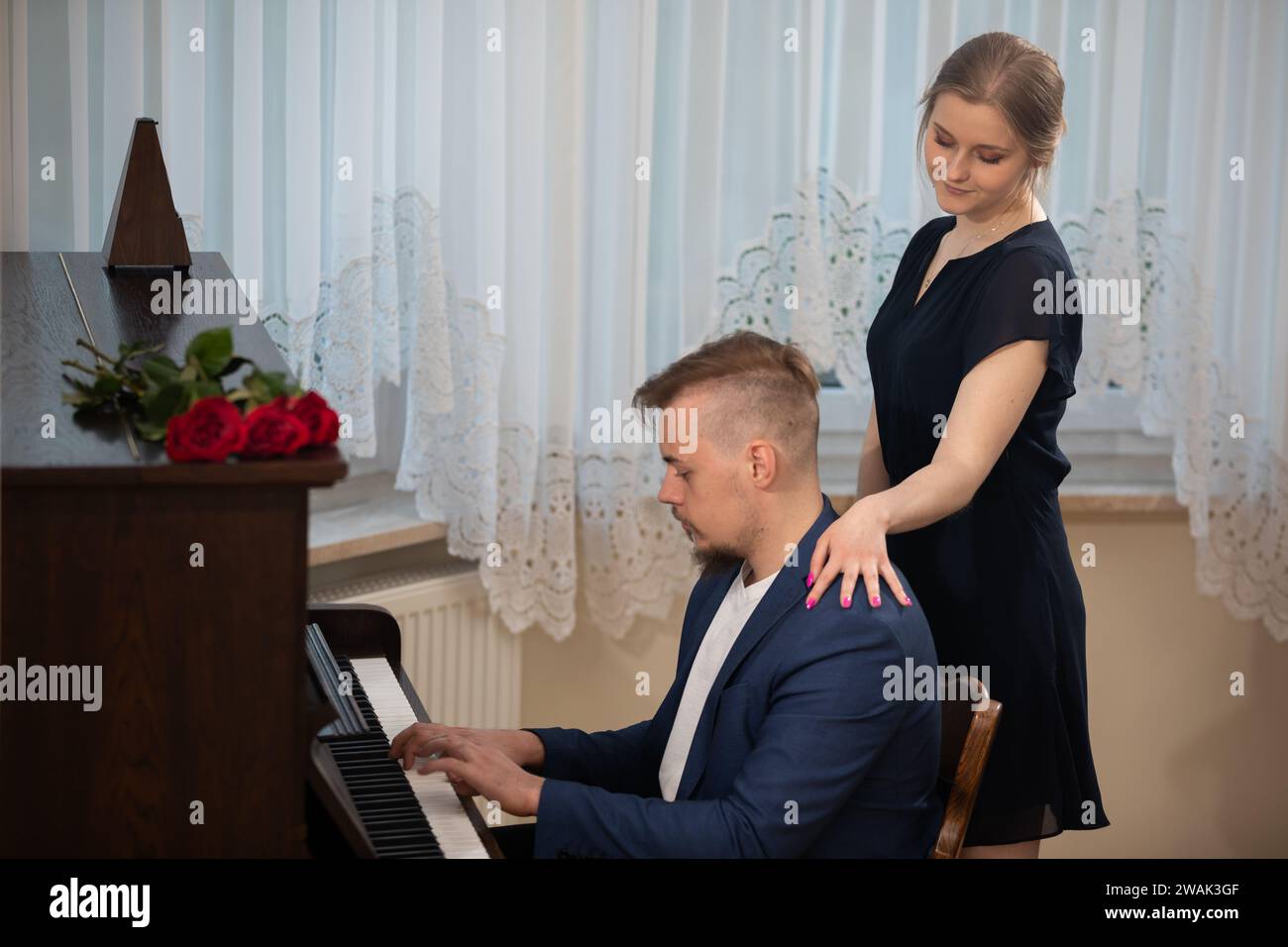 Boy on date plays piano to impress his girlfriend Stock Photo - Alamy